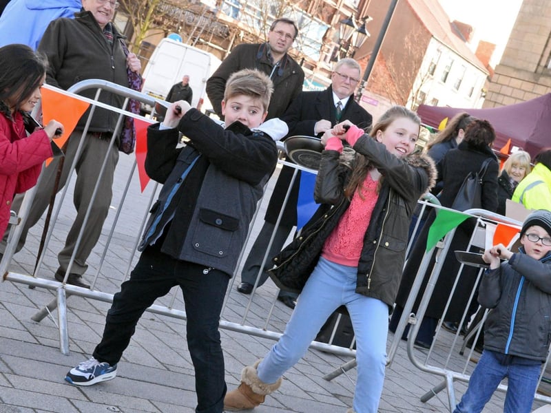 Deputy Civic Mayor Councillor Paul Wray, watches on as the Pancake Olympics at Doncaster Market Place in 2015