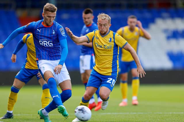 Mansfield's Louis Reed challenges during the Pre Season match against Oldham Athletic AFC at the Boundary Park, 29 July 2023 
Photo Chris & Jeanette Holloway / The Bigger Picture.media