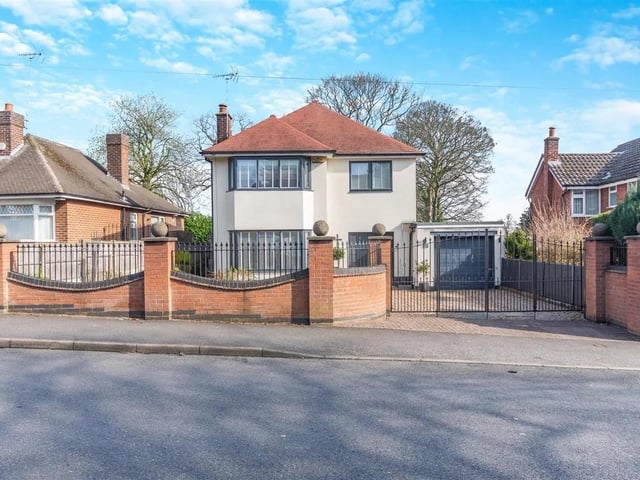The property stands back from Haddon Road behind a walled and railings boundary frontage with double gates opening on to a gravel driveway which leads to a garage with a remote controlled electric door.