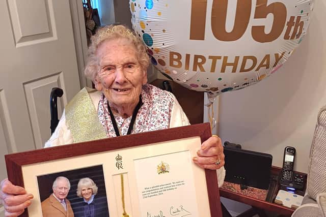 Joan Buet, of Sutton, is all smiles on her 105th birthday.