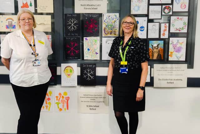 Natasha Wall and Josephine Timpson with students artwork