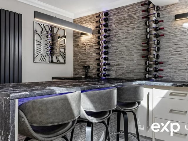The kitchen boasts ample space to showcase your favourite wines