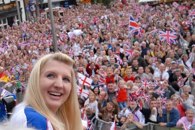Golden girl Rebecca Adlington pictured with thousands of well-wishers in Mansfield during the parade.