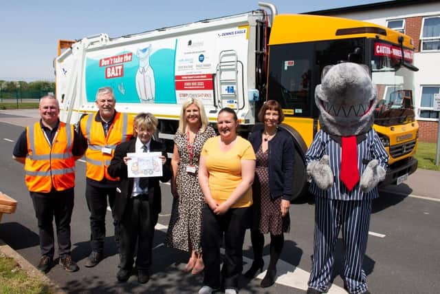 George with staff and councillors and a bin lorry with his winning design.