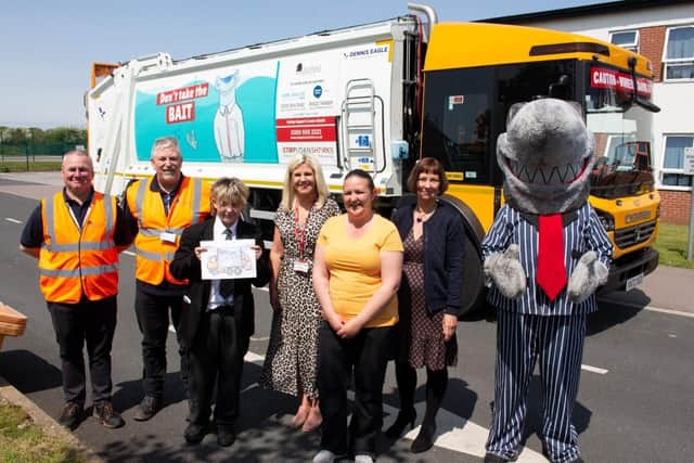 George with staff and councillors and a bin lorry with his winning design.