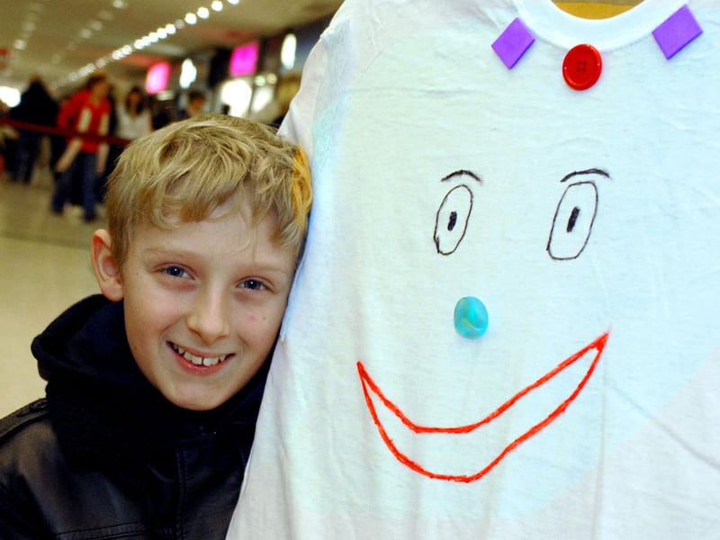 Thomas Johnson with the hospital gown he has designed as part of the Blue Peter Operation Smile appeal in the shopping centre. Year: 2010.
