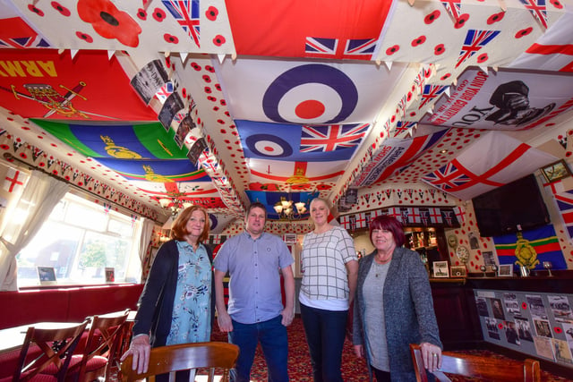 A room at the Rossmere pub, in Owton Manor Lane, Hartlepool was covered in Army and forces flags and decorations in 2018, and pictured with landlord Russ Prentice (2nd left) is wife Lorna (3rd left) with Karen Archbold (left) and Muriel Stewart (right) who helped decorate the room.