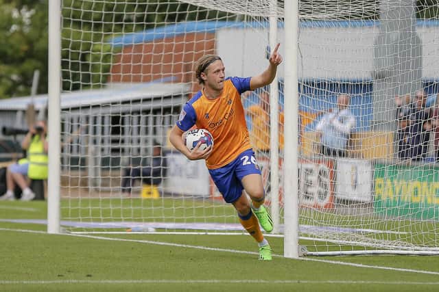 Mansfield Town forward Will Swan grabs the equaliser. PHOTO by Chris Holloway / The Bigger Picture.media