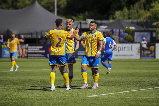 Mansfield Town beat Macclesfield in tough weather conditions.