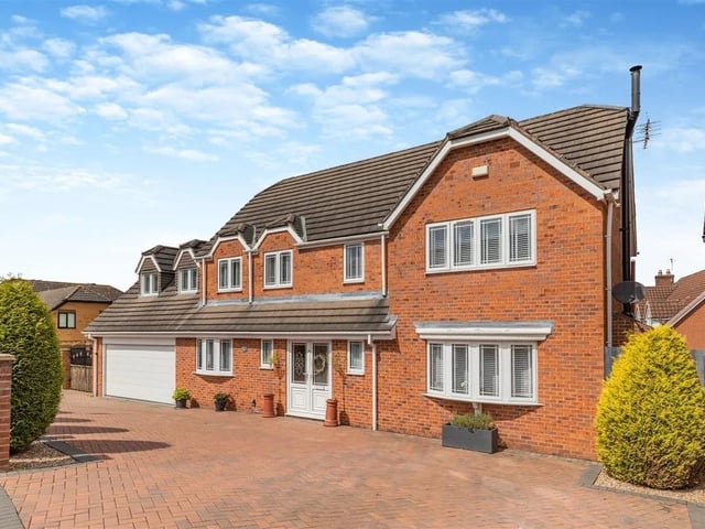 The property occupies a corner plot with substantial block paved in-and-out driveway providing off road parking for numerous vehicles leading to an integral double garage with a remote controlled electric up and over door.