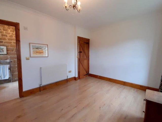 A second image of the main bedroom underlines how much space there is, particularly for wardrobes and storage. To the left are its en suite facilities too.
