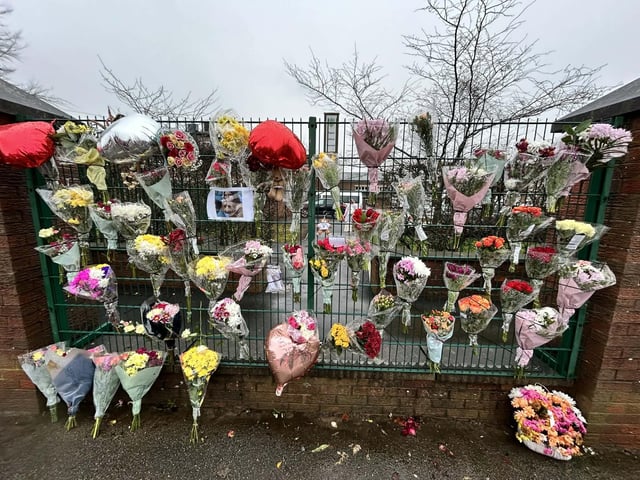 Floral tributes outside Quarrydale Academy