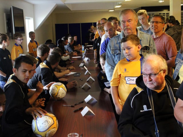 Fans queing to get the players autographs.
