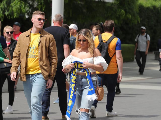 Mansfield Town fans watch the drama unfold inside Wembley.