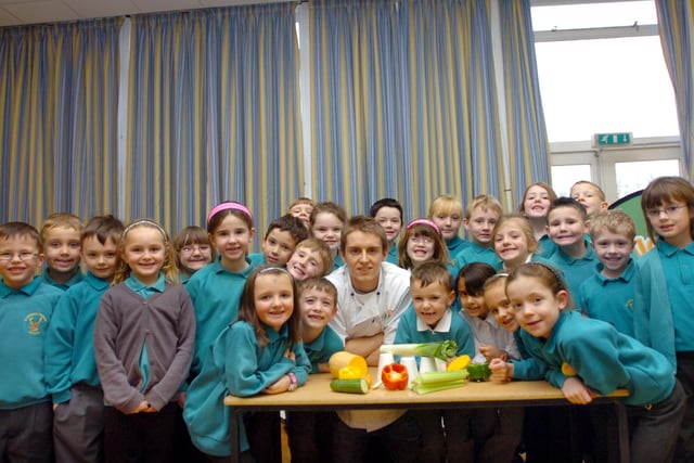 These Clavering Primary School pupils are definitely happy with the food on the menu in this 2009 photo.