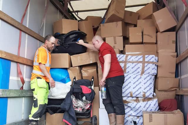 Taylors Transport staff load the eighth lorry load headed to help people in Ukraine. Pictured are Callum Pike  and Stuart Dicks loading the last truck.