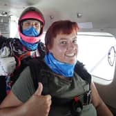 Thumbs up and all set for the big jump -- Lyndsey Allen on her skydive.