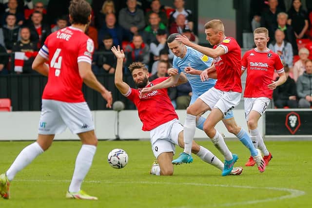 Jamie Murphy is crowded out by Salford City players in Monday's thrilling 2-2 draw at the Peninsula Stadium. Photo by Chris Holloway/The Bigger Picture.media