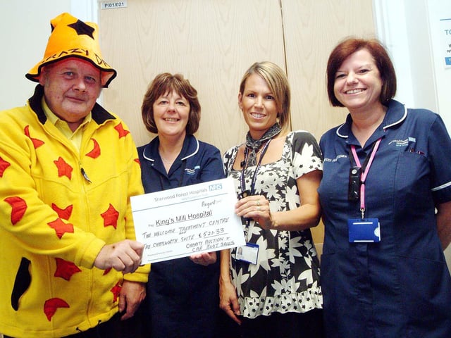 'Crazy' Dave Townsend presented a cheque for £521.23 raised by a charity auction and car boot sale to staff at King's Mill Hospital in 2007. Pictured (left to right) are: fundraiser Dave Townsend from Sutton-in-Ashfield, Wendy Coles, Macmillan Clinical Nurse Leader at the Welcome Treatment Centre, and midwives Jane Sheldon and Maria Curtis.