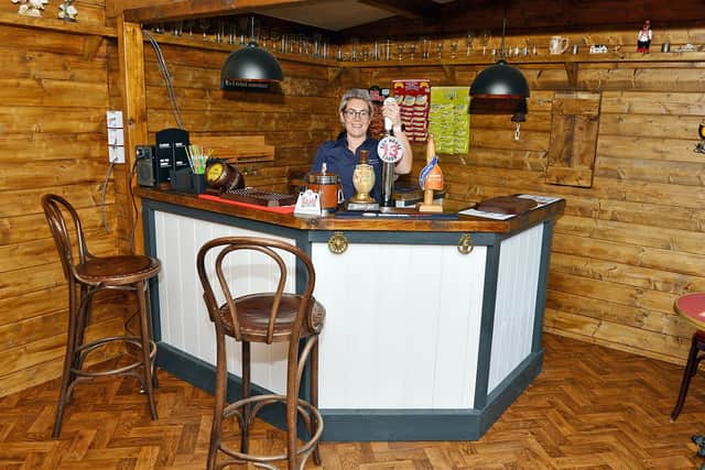 Quality Manager Danielle Cotton pulls a pint at the visitor  'pub pod'  the Ashmere Arms - on the Ashmere Nottinghamshire Ltd site, Priestsic Road, Sutton in Ashfield
