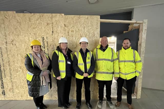 Council officers with the Mayor and Tanbry Construction outside the new Changing Places