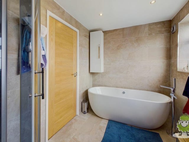 The family bathroom on the first floor also includes this free-standing bath.