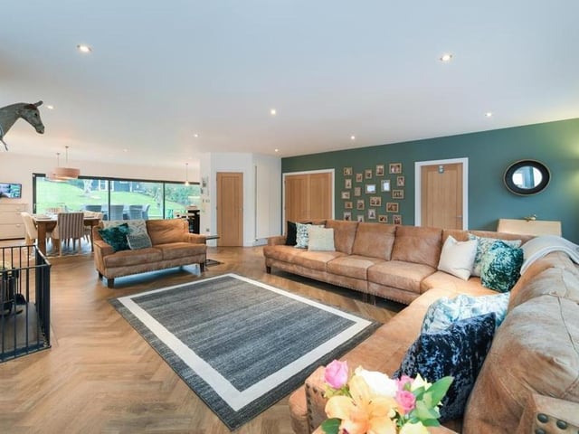As well as size, the lounge has style. In the background, you can see the dining kitchen.