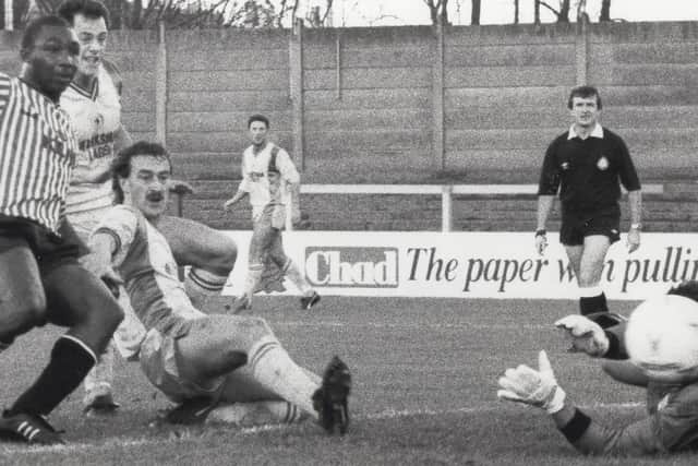 Kevin Kent turns the ball home against Brentford.