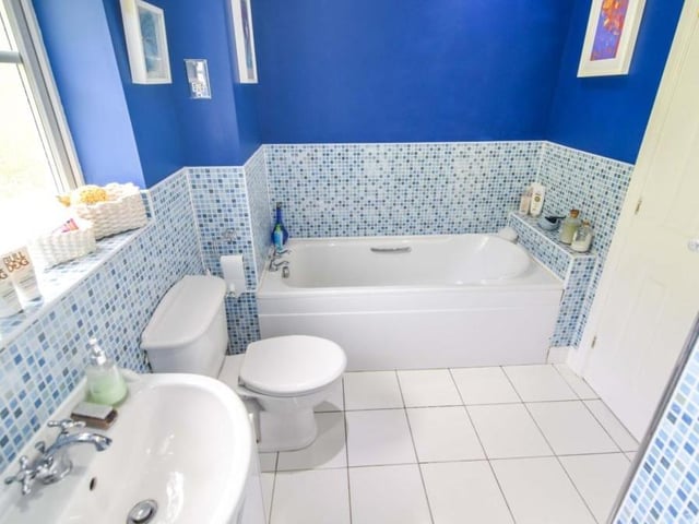 The family bathroom can also be found on the first floor of the Paddock Close property. Pristine, it has all you need.