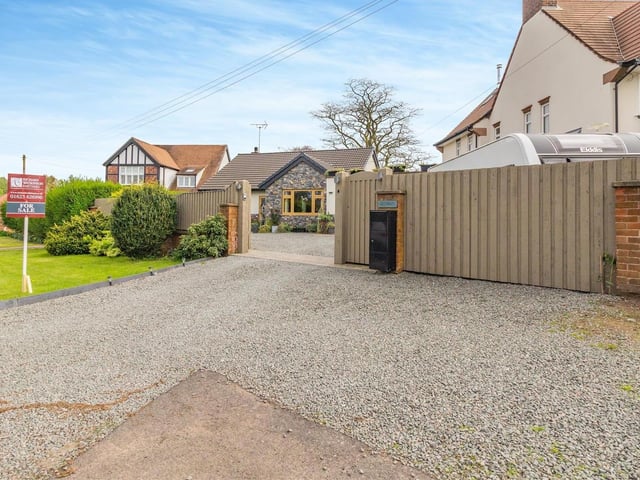 Security is important at the Sutton bungalow. Here is the double-gated entrance with intercom system and live display monitor.