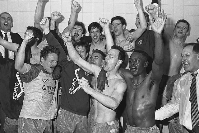Stags players celebrate their last day success in the dressing room.
