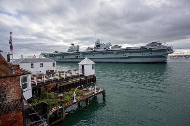 Pictured: HMS QE as it passes The Point, Old Portsmouth. View from Sill & West pub. Picture: Habibur Rahman
