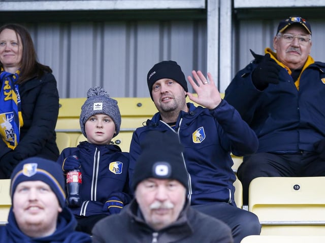 Mansfield fans at The EnviroVent Stadium for the match against Harrogate Town.