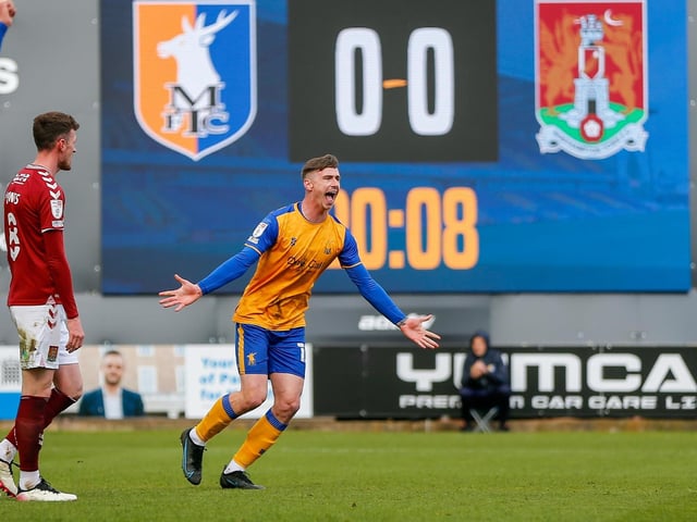 Oli Hawkins celebrates his winner against Northampton Town FC in April.