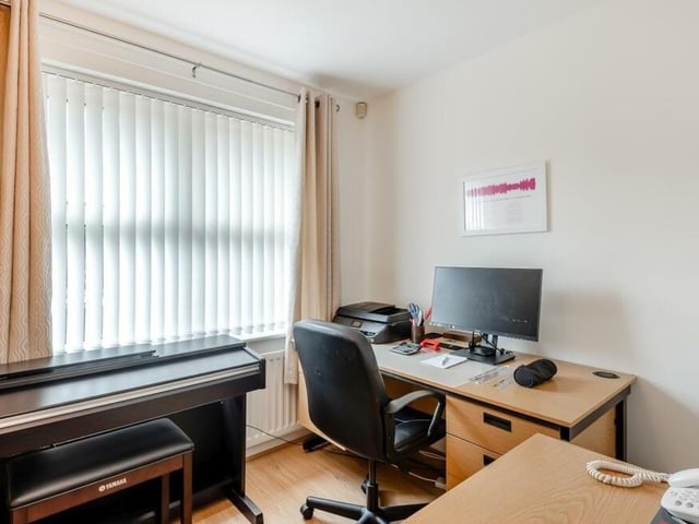 The sixth bedroom is currently being used effectively as a home office. But it does feature fitted wardrobes with hanging rails and shelving.