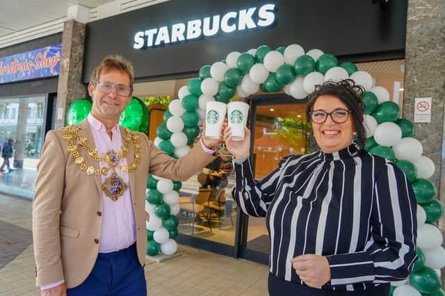 New Mansfield Starbucks in Four Seasons. Mansfield Mayor Andy Abrahams and Starbucks district manager Anne Coleman.