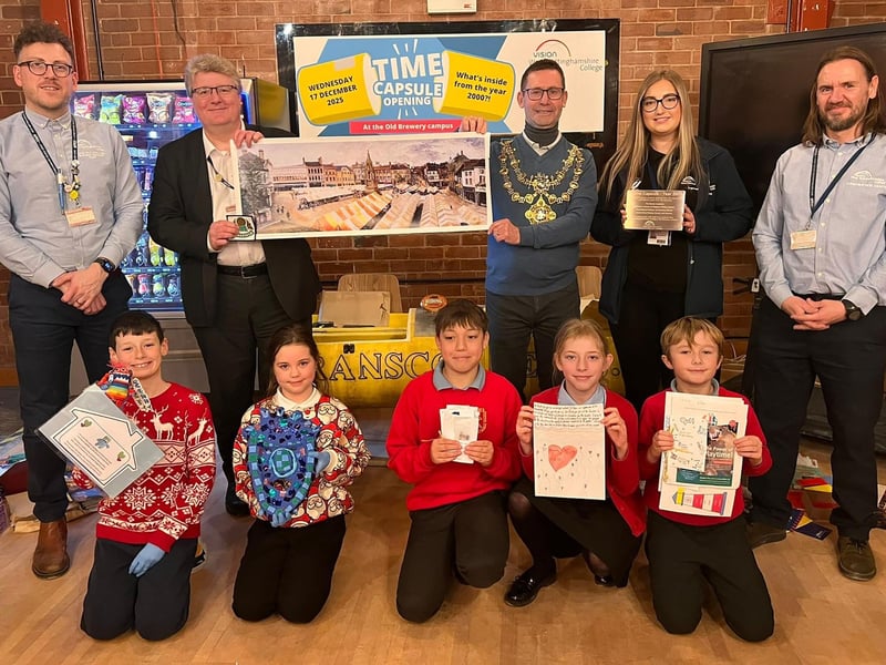 Pupils proudly show off their items with college staff and Mayor Andy Abrahams