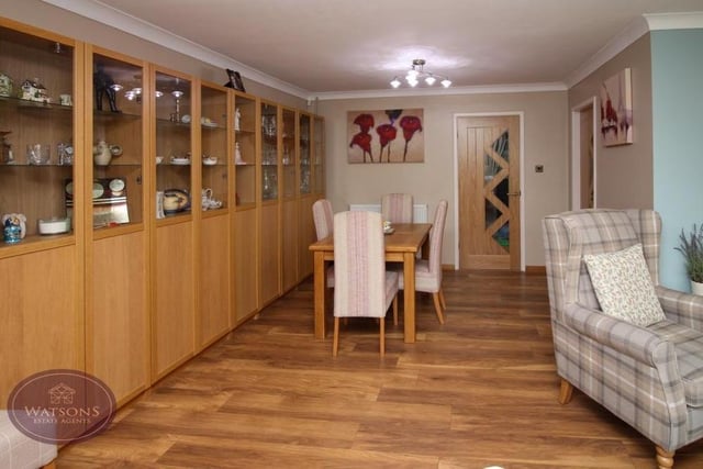 This is the dining room section of the L-shaped lounge, with its wood-effect laminate flooring. As you can see, there is plenty of space for a dining table.
