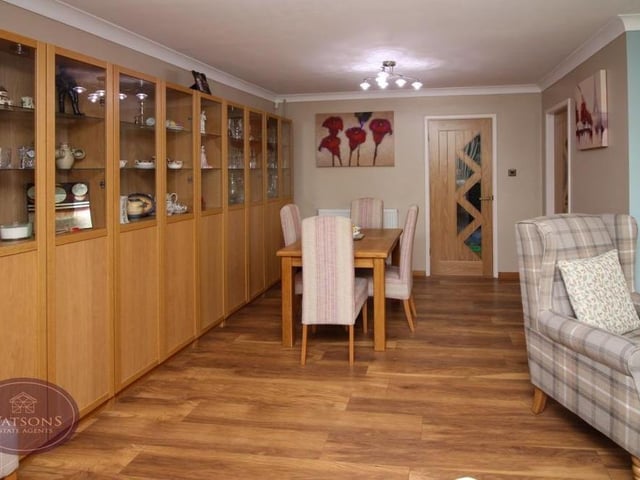 This is the dining room section of the L-shaped lounge, with its wood-effect laminate flooring. As you can see, there is plenty of space for a dining table.