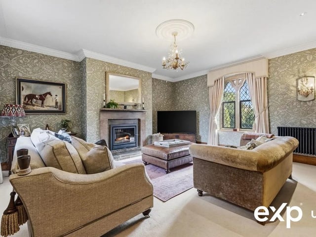 This cosy room features a superb feature stone fireplace with a log-burning fire