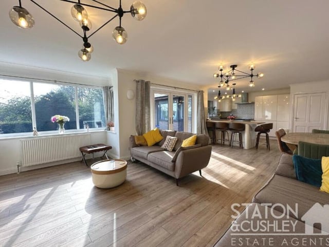The central focal point of the whole house is this open-plan lounge and kitchen, which creates the perfect space to dine, relax and socialise. As you can see, double-glazed French doors open out to the rear garden.