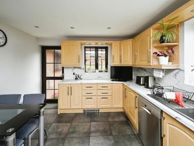 Next stop on our tour is the well-appointed kitchen, which combines functionality and style. As you can see, there is space for a breakfast table.