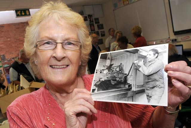Mansfield Museum Metal Box Memory Day in 2010. Here is Pam Bird pictured with a Chad photograph of her late husband George who wound the Metal Box Clock every Friday.
