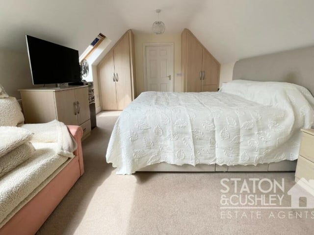 This is the master bedroom on the upper floor of the Leeming Lane North property. It has two Velux windows facing the front of the house, two fitted wardrobes and a walk-in wardrobe. It also has access to a dressing room and an en suite shower room.