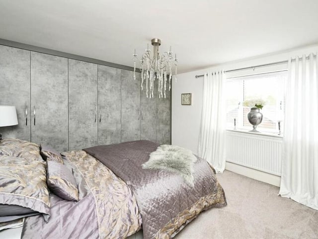 This gorgeous second-floor bedroom is lavishly presented, and offers extensive, built-in wardrobes, as well as access to an en suite shower room. It overlooks the rear garden.
