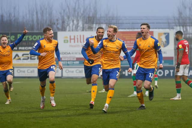 The team celebrate Harry Charsley's goal against Walsall. Photo by Chris Holloway / The Bigger Picture.media