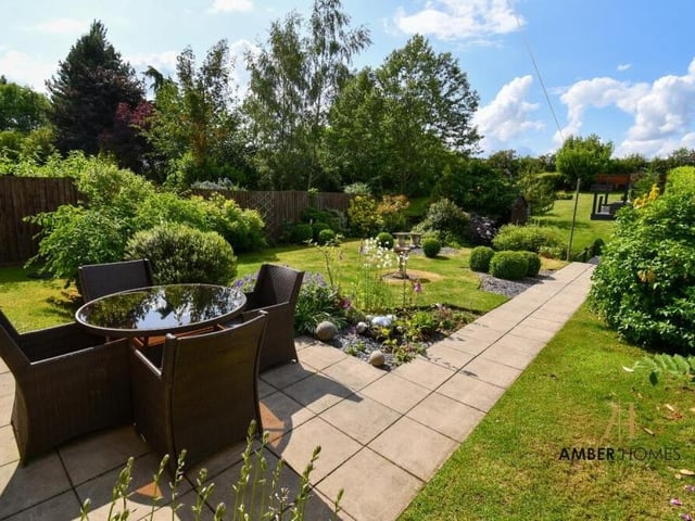 Big and beautiful is the only way to describe the back garden, which encapsulates the rural setting of the property. With its lawns, patio, pathways, shrubs and trees, it is the ideal place for outdoor gatherings or for simply enjoying the beauty of nature.