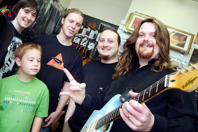 Professional guitarist Gav Copulson, right, pictured during his visit to Mills Music on Mansfield's Leeming Street, where he gave demonstrations of his skill to shop visitors and staff using the Vintage range of guitars (2007).  Also pictured are from left, Mark Townley, James Cross, Carl Reynolds and Sam Limb