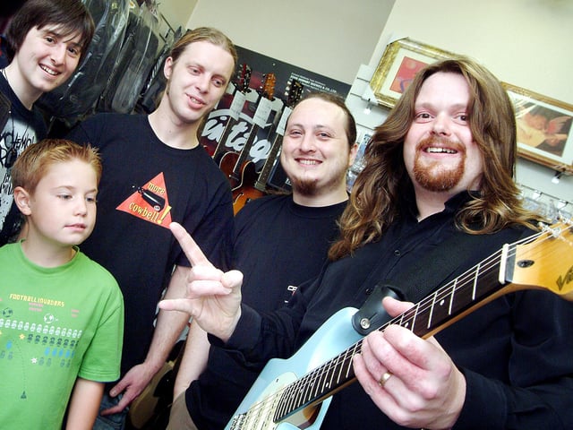 Professional guitarist Gav Copulson, right, pictured during his visit to Mills Music on Mansfield's Leeming Street, where he gave demonstrations of his skill to shop visitors and staff using the Vintage range of guitars (2007). Also pictured are from left, Mark Townley, James Cross, Carl Reynolds and Sam Limb