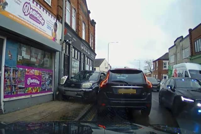A car became wedged between lamppost and a parked car after pursuit in Kirkby